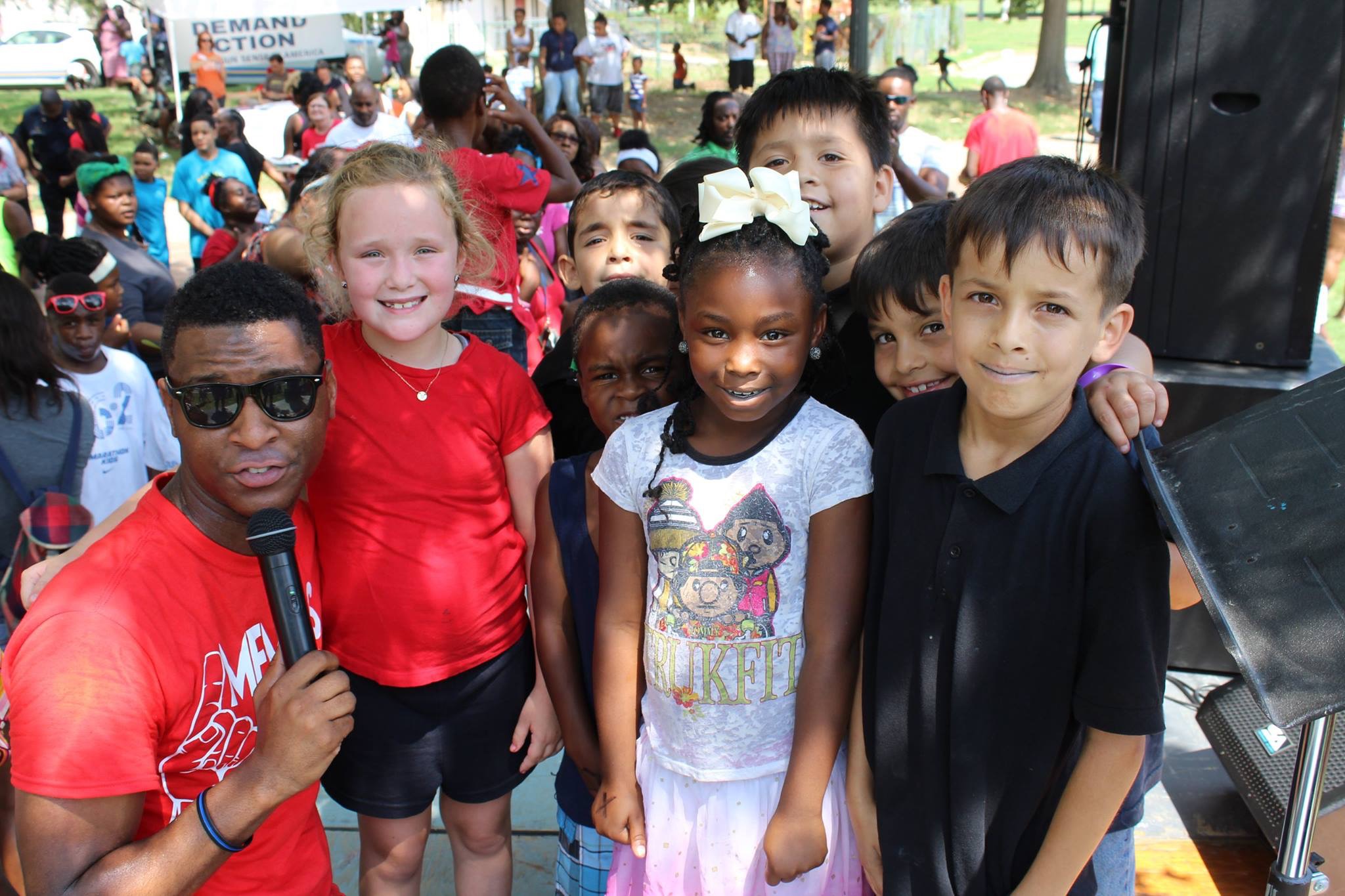 Devante Hill with children at a community event